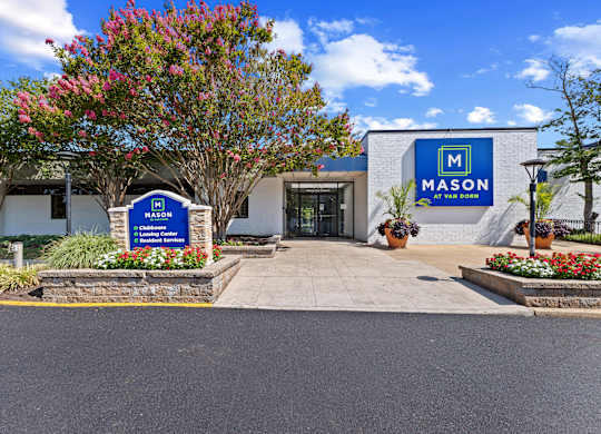 The front of a building with a sign that says Mason on it.