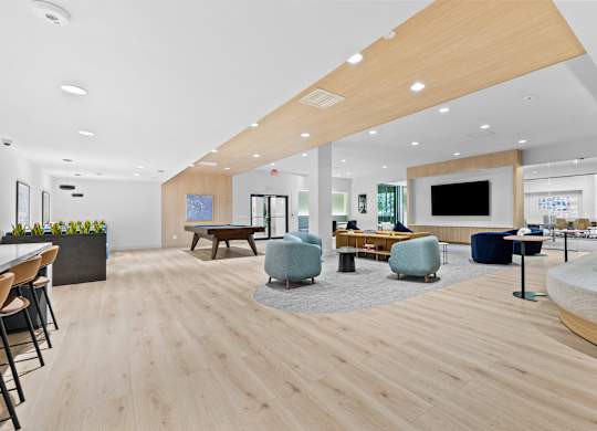 A modern office space with wooden floors and furniture.