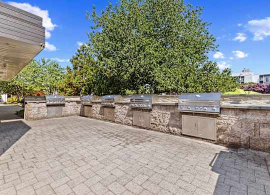 A stone wall with a row of mailboxes on it.