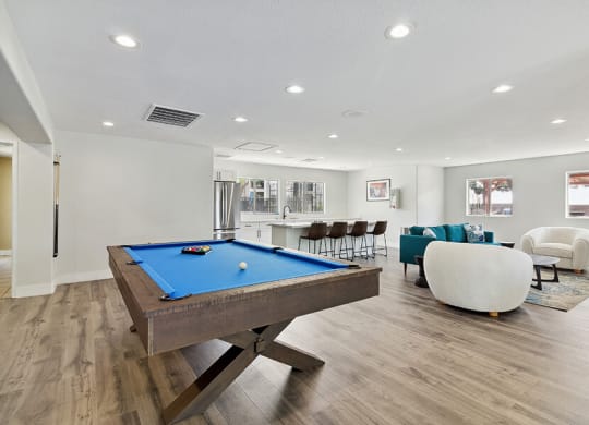 Community Clubhouse with Game Tables, Lounge Furniture and Kitchenette at Loma Vista Apartments in Las Vegas, NV.
