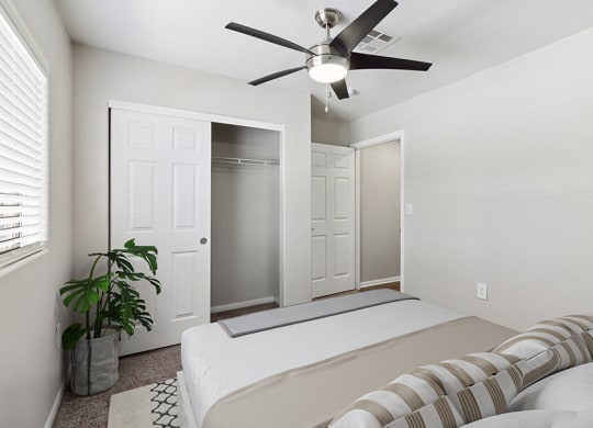 Model Bedroom with Carpet and Closet at Loma Vista Apartments in Las Vegas, NV.