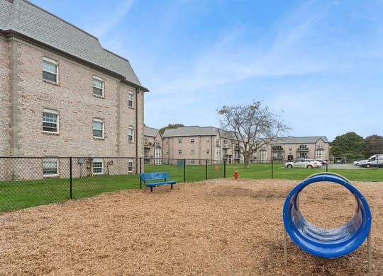 Community Dog Park with Agility Equipment at Meadows at Marlborough Apartments located in Marlborough, MA.