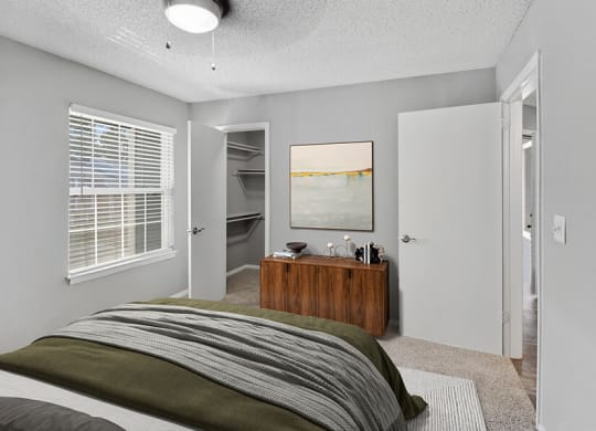 Model Bedroom with Carpet and Walk In Closet at Abbington Heights Apartments in Antioch, TN.