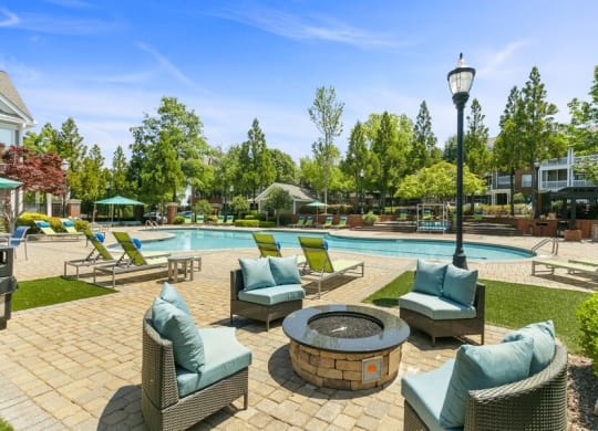 Poolside firepit and lounge chairs