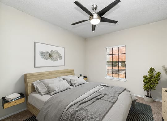 Model Bedroom with Carpet and Window View at Dallas North Park Apartments in Dallas, TX.