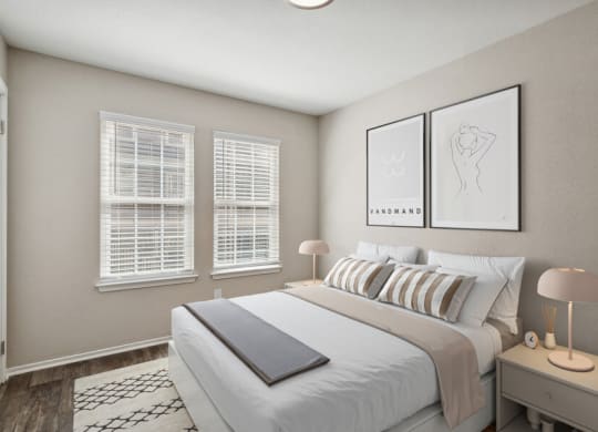 a bedroom with a bed and three windows