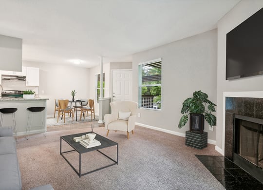 Model Living Room with Carpet, Fireplace and View of Kitchen at Park 2300 Apartments in Charlotte, NC.