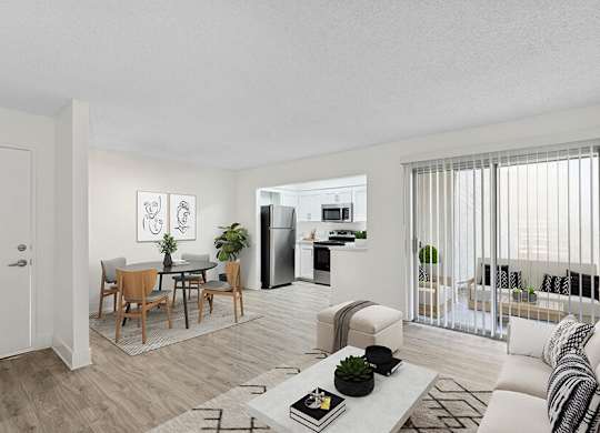 Model Living Room with Wood-Style Flooring and Patio Accessibility at Horizon Apartments located in Santa Ana, CA.