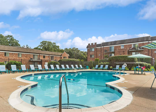 Community Swimming Pool with Pool Furniture at Heights Marlborough Apartments in Boston, MA.