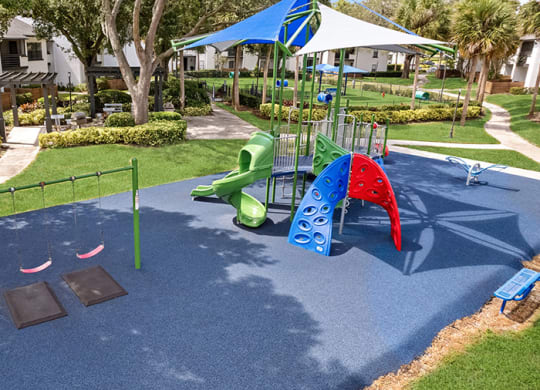 Aerial View of Community Playground and Swing Set at Rosehill Preserve Apartments in Orlando, FL.