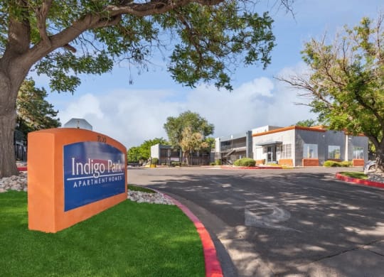 Monument Sign and Front Entrance at Indigo Park Apartments in Albuquerque, NM.