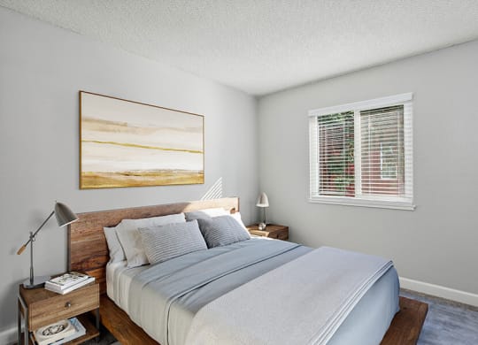 Model Bedroom with Carpet and Window View at The Archer Apartments in Sacramento, CA.