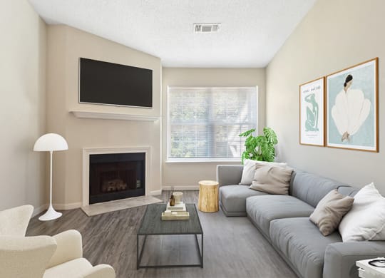 Model Living Room with Wood-Style Flooring and Fireplace at The Commons at Haynes Farm Apartments in Boston, MA.