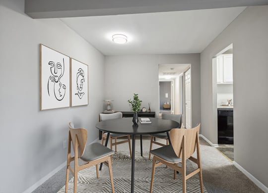 Model Dining Room with Carpet and View of Kitchen at Spring Parc Apartments in Silver Spring, MD.