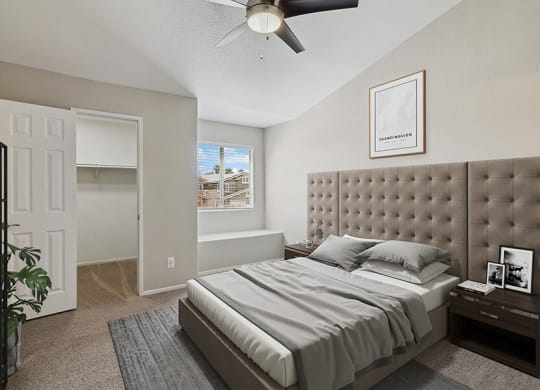 Model Bedroom with Carpet, Walk in Closet & Window Bench at Verraso Apartments in Las Vegas, NV.