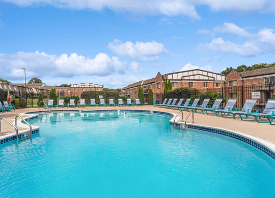 Community Swimming Pool with Pool Furniture at Heights Marlborough Apartments in Boston, MA.
