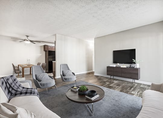Model Living Room with Wood-Style Flooring at Paramont Apartments in Duluth, GA.