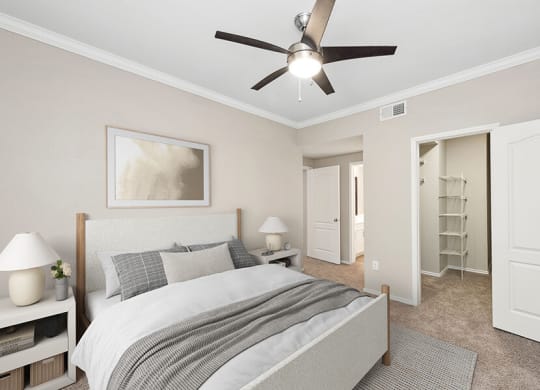 Model Bedroom with Carpet and Walk In Closet at Allure North Dallas Apartments located in Dallas, TX.