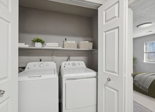 Model Laundry Room with Washer and Dryer at Spring Forest Apartments in Raleigh, NC.