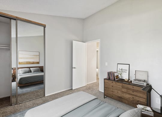 Model Bedroom with Carpet and Closet at Bridges on Sunset Apartments in Suisun City, CA.