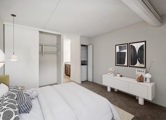 Model Bedroom with Carpet, Closet and Attached Bathroom at Mason Van Dorn Apartments located in Alexandria, VA.