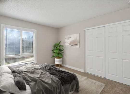 Model bedroom with a bed and a window