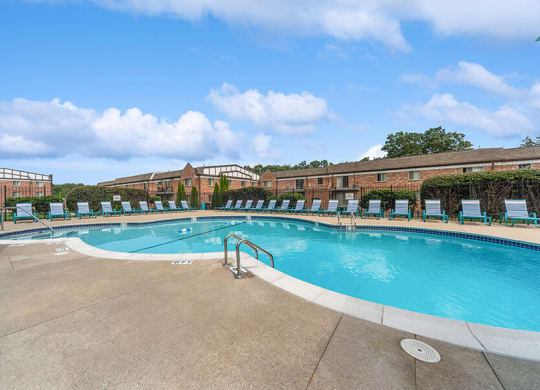 Community Swimming Pool with Pool Furniture at Heights Marlborough Apartments in Boston, MA.
