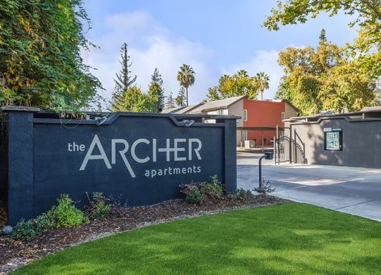 Monument Sign and Front Entrance at The Archer Apartments in Sacramento, CA.