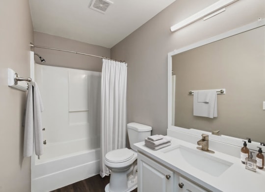 Model bathroom with white vanity at Vue at Baymeadows Apartments in Jacksonville, Florida