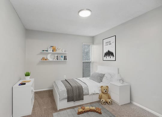 Model Bedroom with Carpet and Window View at Parc at Creekside Apartments in Kansas City, MO.