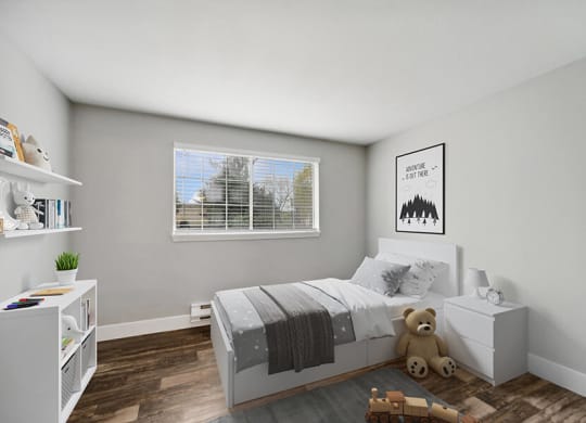 Model Bedroom with Wood-Style Flooring and Window View at Central Flats Apartments in Kent, WA.