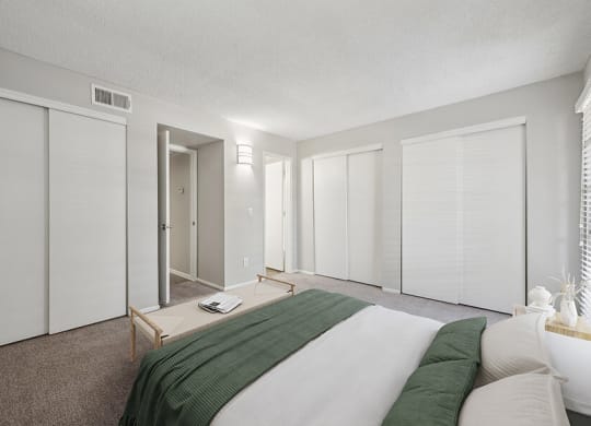 Model Bedroom with Carpet and Window View at Country Club Verandas Apartments located in Mesa, AZ.