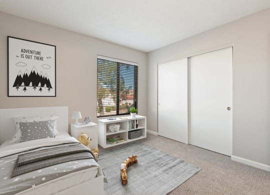 Model apartment bedroom with a bed and a window at Saratoga Ridge, Phoenix, 85022