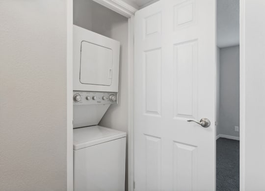 Model Unit Stackable Washer and Dryer Hook Up at Overlook Point Apartments in Salt Lake City, UT.