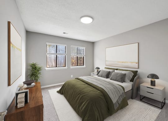 Model Bedroom with Carpet and Window View at Spring Forest Apartments in Raleigh, NC.