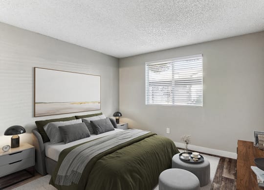 Model Bedroom with Wood-Style Flooring at Meadow Ridge Apartments in Las Vegas, NV.