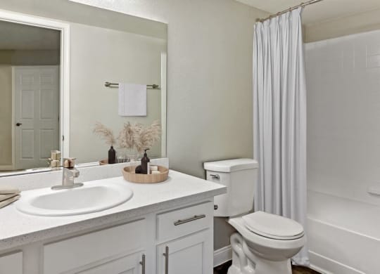 Model bathroom with a sink toilet and shower