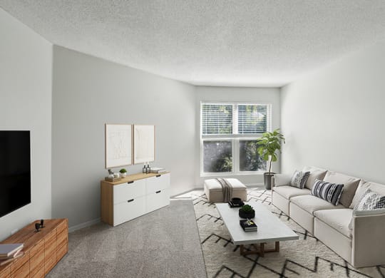 Model Living Room with Carpet and Window View at Arbor Village Apartments located in Charlotte, NC.