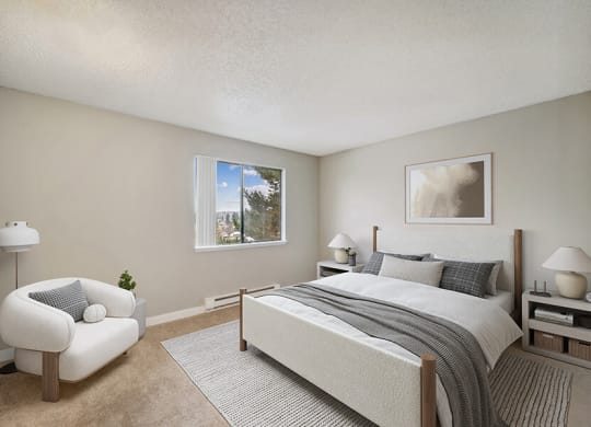 Model Bedroom with Carpet and Window View at Grammercy Apartments located in Renton, WA.