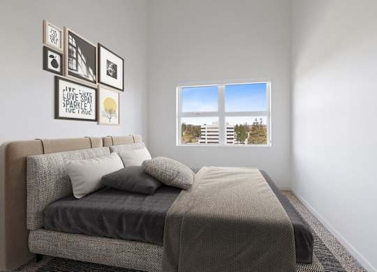 Model bedroom with carpet and large window