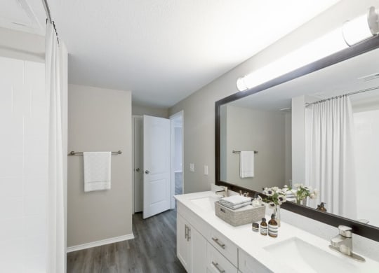 Model bathroom with large mirror