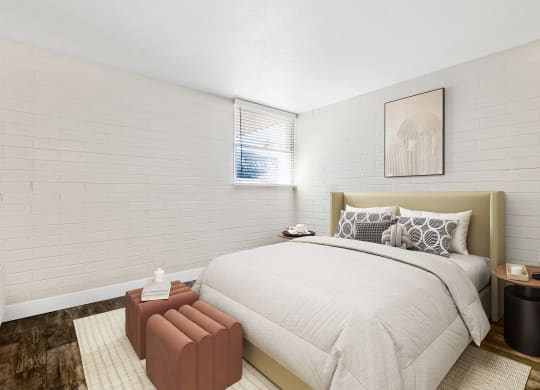 Model Bedroom with Wood-Style Flooring and Window View at Arcadia on 49th Apartments located in Phoenix, AZ.