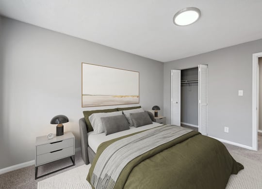 Model Bedroom with Carpet and Closet at Spring Forest Apartments in Raleigh, NC.