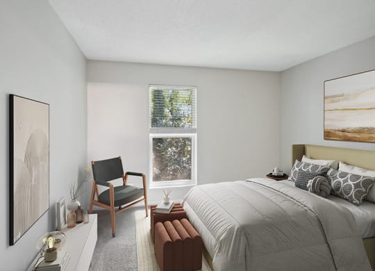 Model Bedroom with Carpet and Window View at Arbor Village Apartments located in Charlotte, NC.