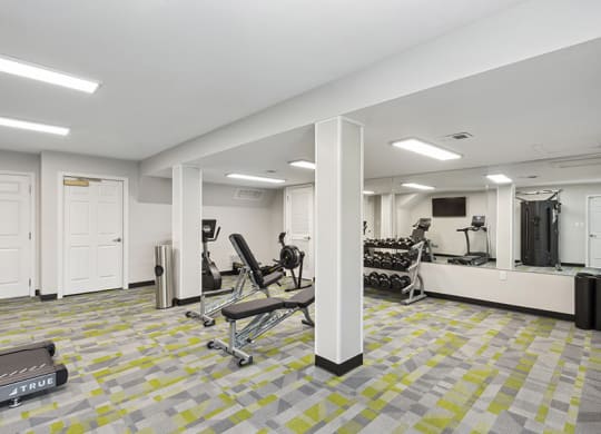 Community Fitness Center with Equipment at Parc at Creekside Apartments in Kansas City, MO.