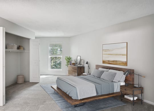 Model Bedroom with Carpet and Window View at Arbor Village Apartments located in Charlotte, NC.