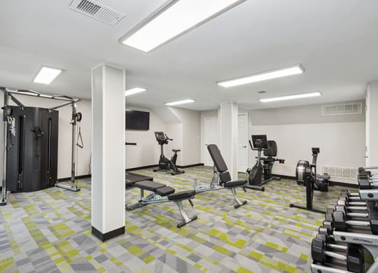 Community Fitness Center with Equipment at Parc at Creekside Apartments in Kansas City, MO.