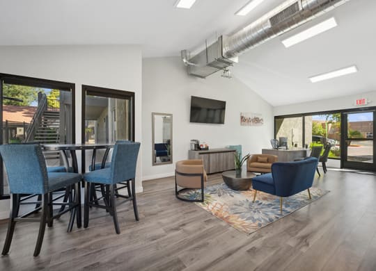 Community Clubhouse with Lounge Furniture and TV at Villages at Metro Center Apartment located in Phoenix, AZ.