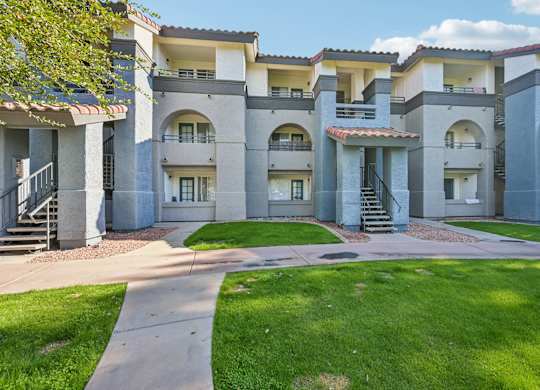 Stillwater Apartments with a walkway in front.