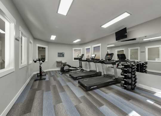 Community Fitness Center with Equipment at Landings at Morrison Apartments located in Gresham, OR.